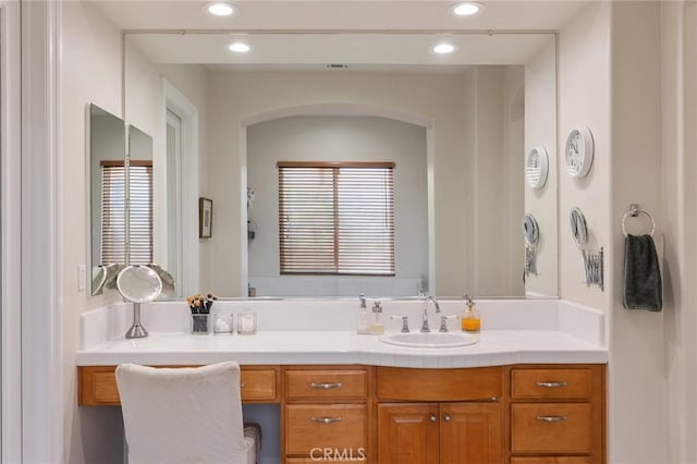 bathroom featuring vanity and recessed lighting