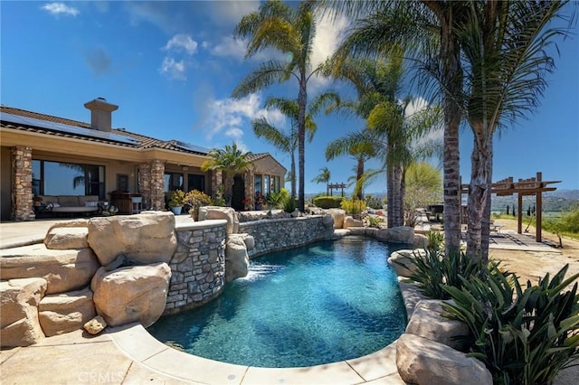 outdoor pool featuring a patio and a pergola