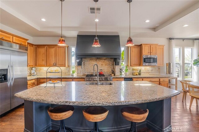 3863 Flowerwood Ln, Fallbrook, CA 92028 - kitchen featuring built in appliances, a tray ceiling, dark wood finished floors, and recessed lighting
