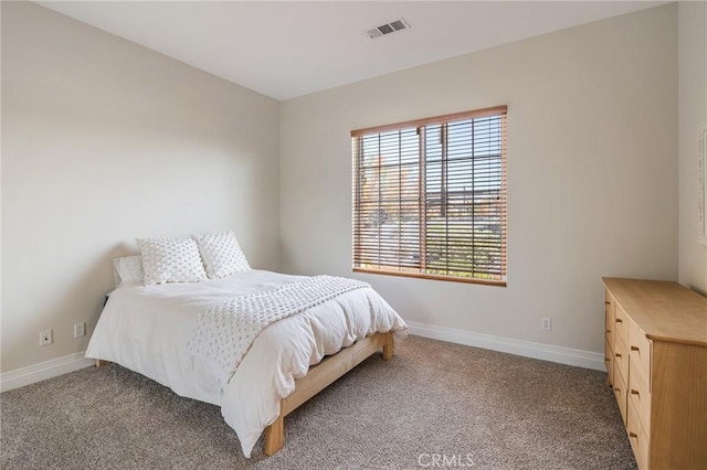 bedroom featuring carpet floors, baseboards, and visible vents
