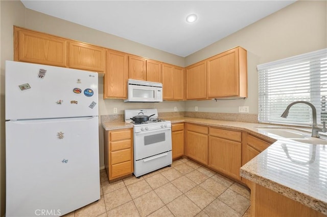 kitchen featuring light tile patterned flooring, a sink, light brown cabinets, white appliances, and light countertops