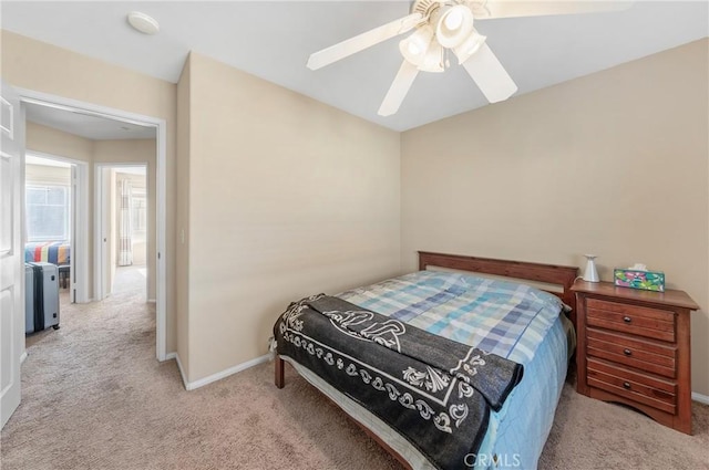 bedroom featuring baseboards, carpet, and ceiling fan