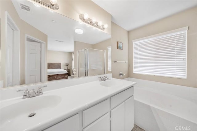 full bathroom featuring a sink, a shower stall, a bath, and visible vents