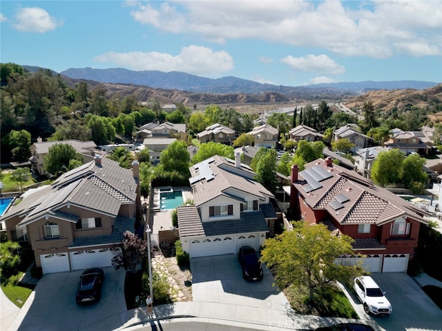 birds eye view of property with a mountain view and a residential view