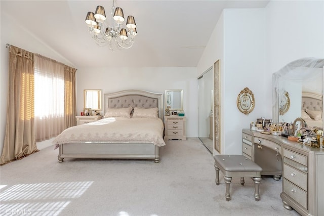 bedroom featuring a notable chandelier, vaulted ceiling, and light carpet