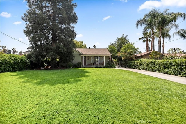 view of yard with a sunroom