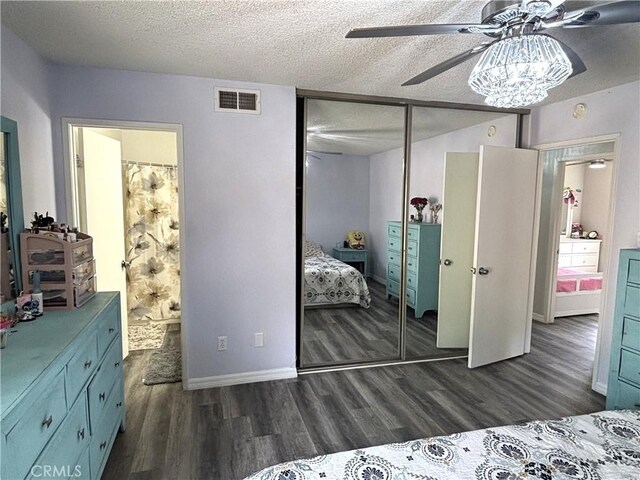 6845 Butte Dr, Riverside, CA 92505 - bedroom with dark wood-type flooring, a closet, a textured ceiling, ensuite bathroom, and baseboards