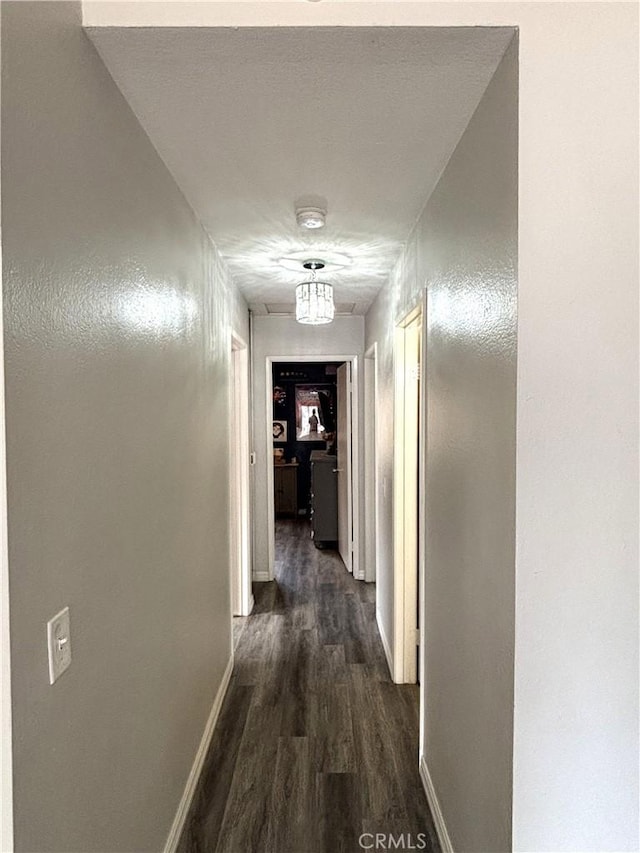6845 Butte Dr, Riverside, CA 92505 - hallway featuring dark wood finished floors and baseboards