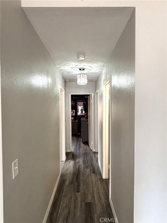 6845 Butte Dr, Riverside, CA 92505 - corridor with dark wood-style flooring and baseboards