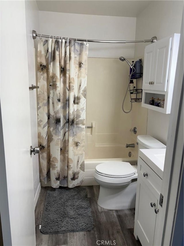 6845 Butte Dr, Riverside, CA 92505 - full bath with shower / bath combo with shower curtain, wood finished floors, toilet, and vanity