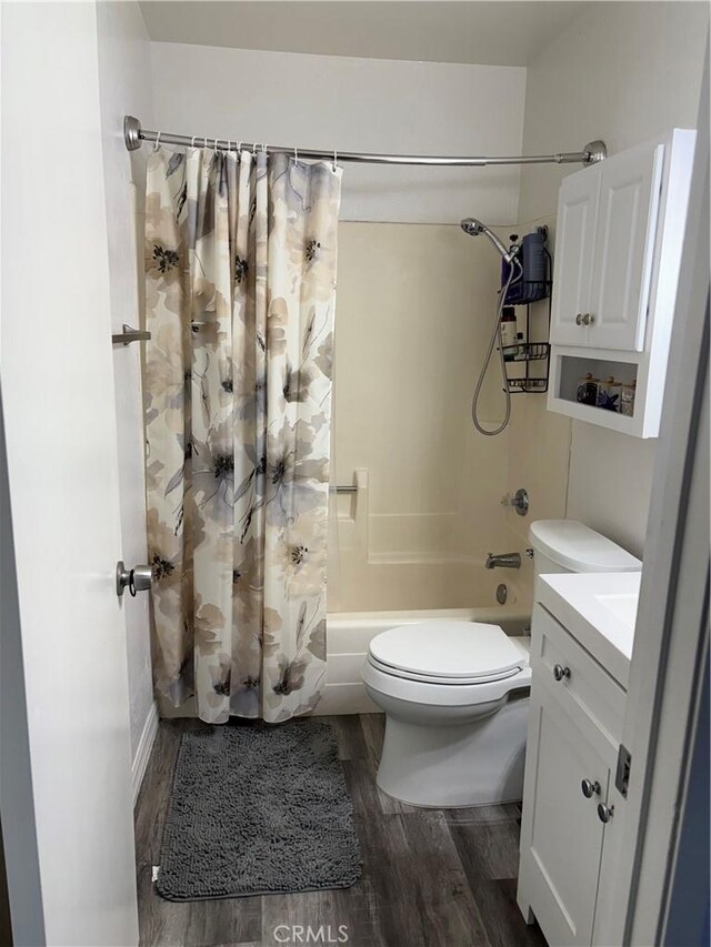 6845 Butte Dr, Riverside, CA 92505 - bathroom featuring shower / bath combination with curtain, wood finished floors, toilet, and vanity