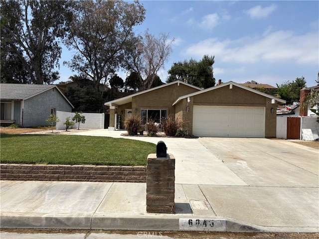 6845 Butte Dr, Riverside, CA 92505 - view of front of property featuring a garage, stucco siding, and concrete driveway
