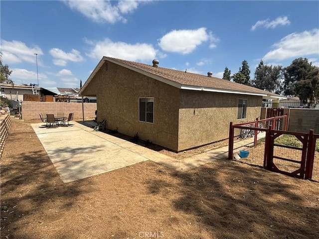 6845 Butte Dr, Riverside, CA 92505 - view of home's exterior featuring stucco siding and a patio