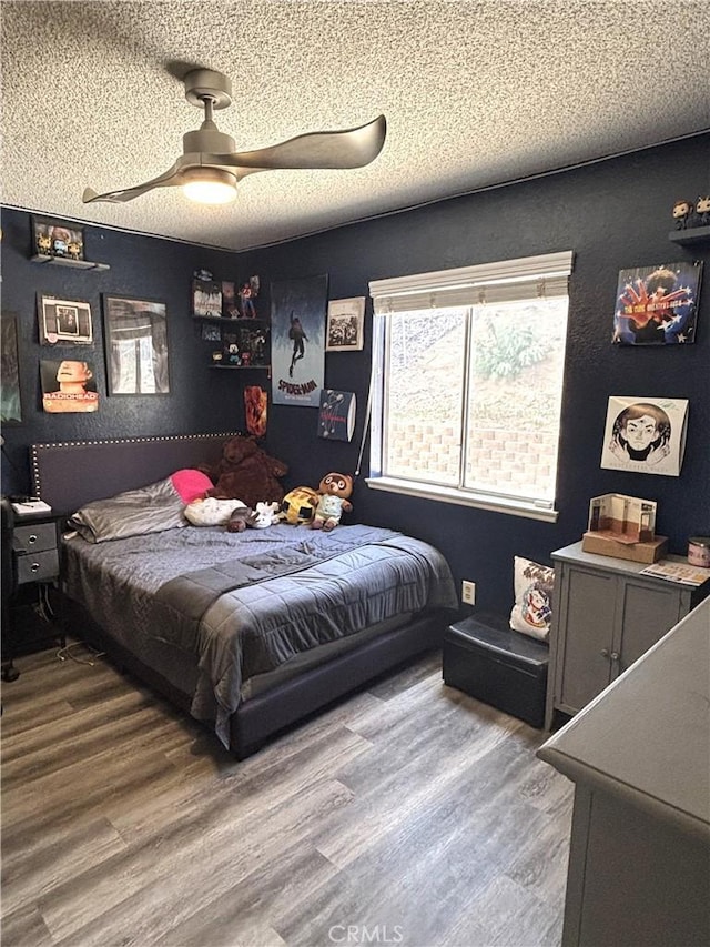 6845 Butte Dr, Riverside, CA 92505 - bedroom with wood finished floors, a ceiling fan, and a textured ceiling