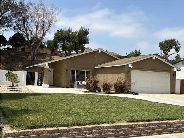 6845 Butte Dr, Riverside, CA 92505 - view of front facade with stucco siding, an attached garage, and concrete driveway