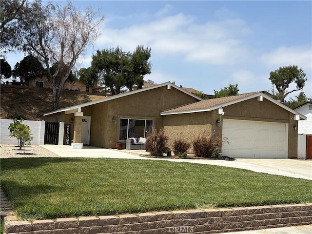 6845 Butte Dr, Riverside, CA 92505 - view of front of home with stucco siding, a garage, and concrete driveway