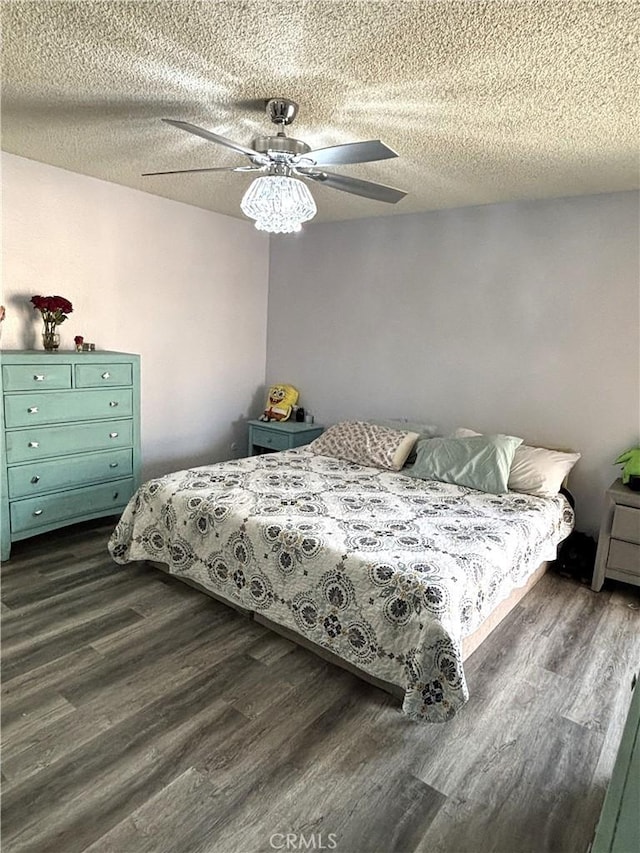 6845 Butte Dr, Riverside, CA 92505 - bedroom featuring dark wood finished floors, a textured ceiling, and ceiling fan