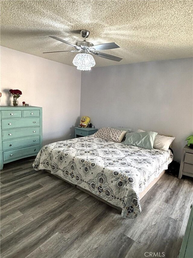 6845 Butte Dr, Riverside, CA 92505 - bedroom with dark wood-type flooring, a textured ceiling, and ceiling fan