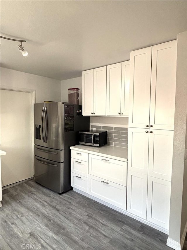 6845 Butte Dr, Riverside, CA 92505 - kitchen with stainless steel appliances, dark wood-style floors, white cabinetry, and light countertops