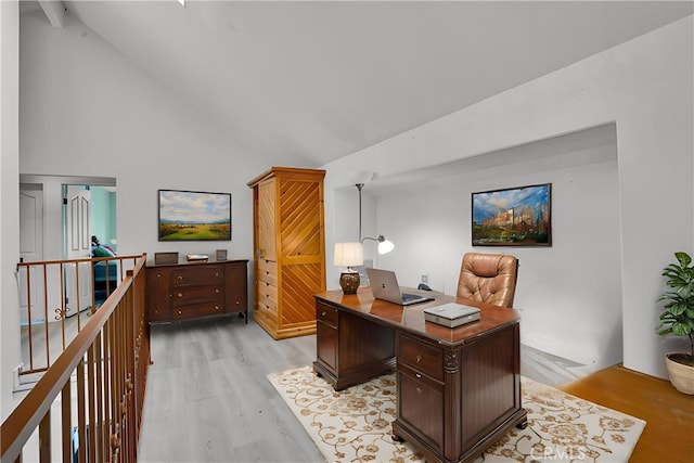 office featuring high vaulted ceiling and light wood-style floors