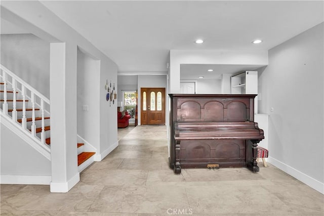 interior space featuring recessed lighting and baseboards