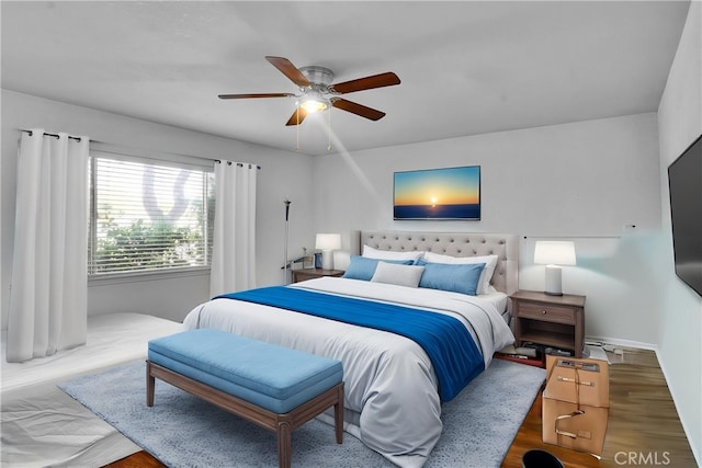 bedroom featuring a ceiling fan and wood finished floors