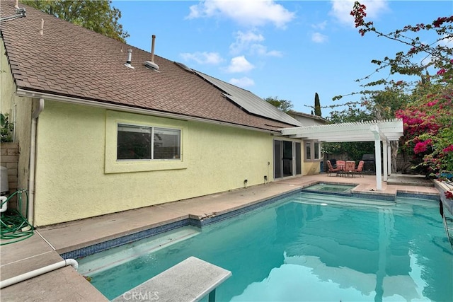 view of swimming pool featuring a diving board, a pergola, a fenced in pool, an in ground hot tub, and a patio area