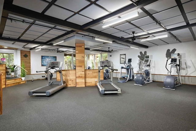 exercise room featuring wood walls