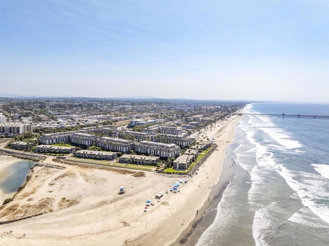 aerial view featuring a water view and a beach view