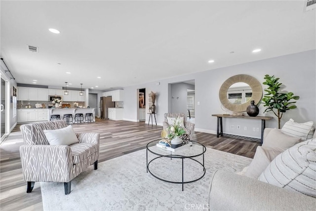 20372 Crooked Branch St, Riverside, CA 92507 - living room with light wood-style floors, recessed lighting, and baseboards