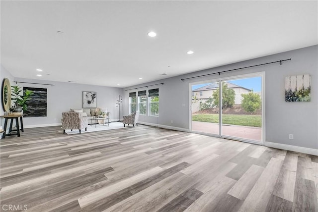 20372 Crooked Branch St, Riverside, CA 92507 - unfurnished living room featuring recessed lighting, light wood-style floors, and baseboards