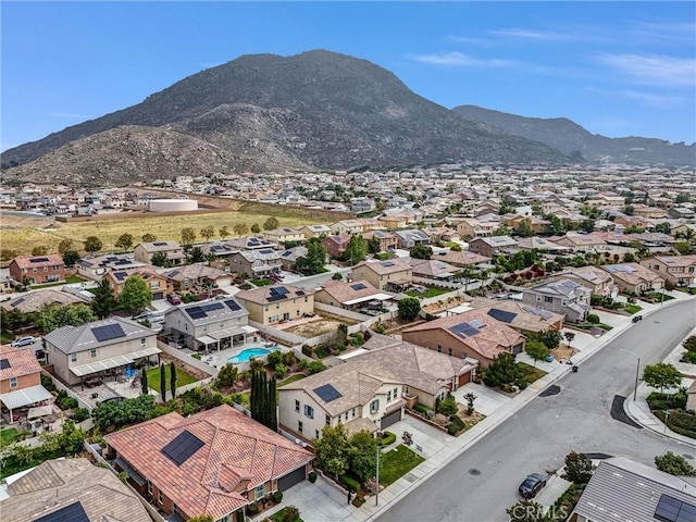 aerial view of residential area featuring mountains