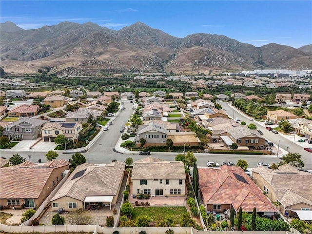 aerial perspective of suburban area with a mountainous background