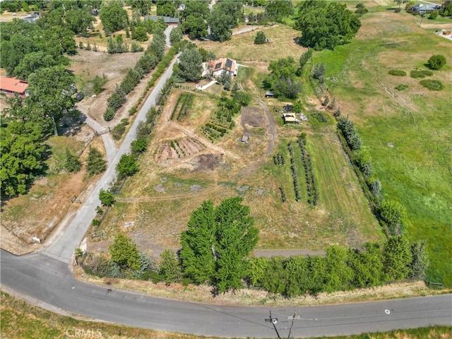 birds eye view of property featuring a rural view