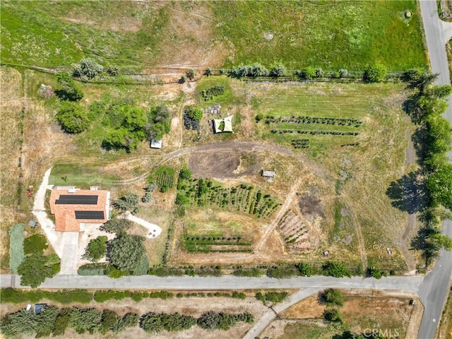 birds eye view of property with a rural view