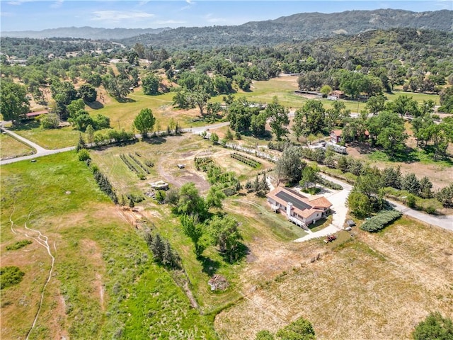 birds eye view of property featuring a rural view and a mountain view