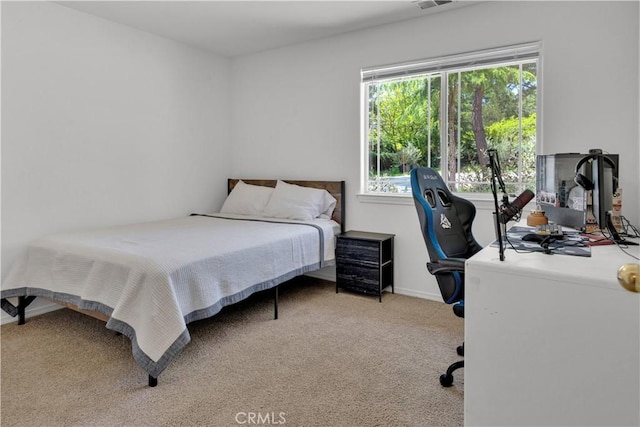 bedroom with carpet flooring, baseboards, and visible vents