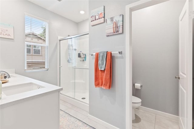 full bathroom with a sink, tile patterned flooring, a stall shower, and toilet