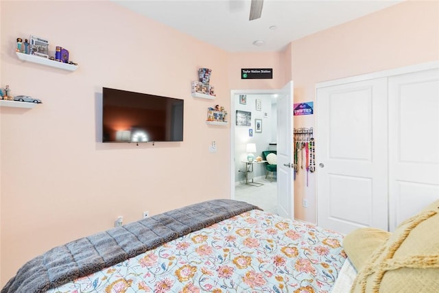 carpeted bedroom with a closet and a ceiling fan