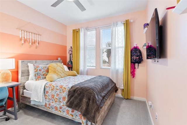bedroom featuring carpet, baseboards, and a ceiling fan