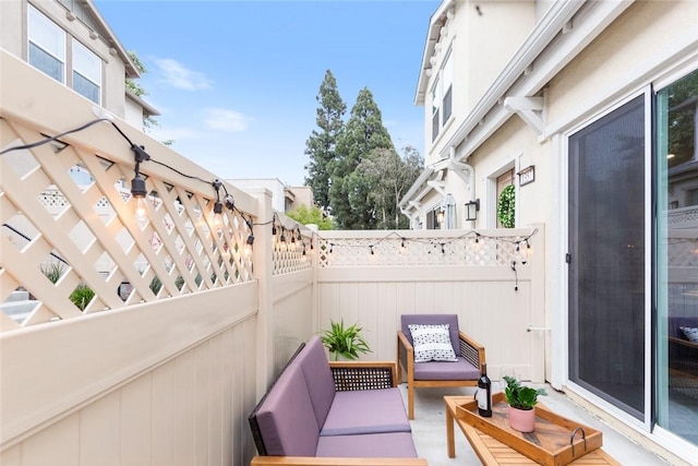view of patio / terrace with fence and an outdoor hangout area