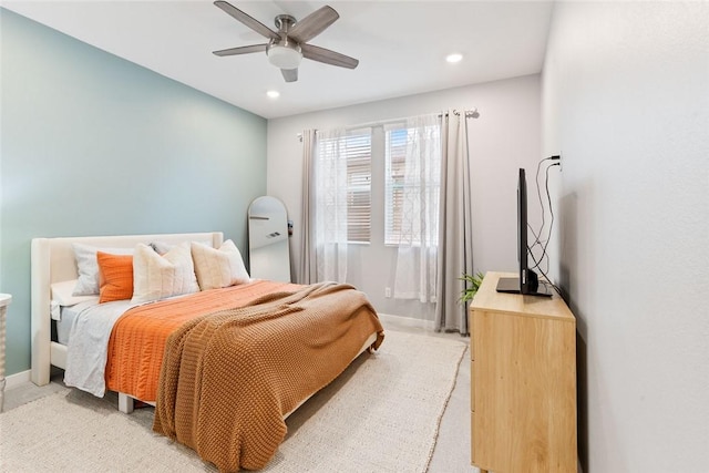 bedroom with recessed lighting, a ceiling fan, light colored carpet, and baseboards