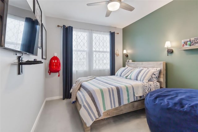 carpeted bedroom with baseboards and ceiling fan