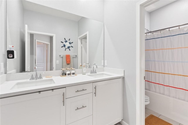 bathroom with tile patterned floors, double vanity, toilet, and shower / bath combination with curtain