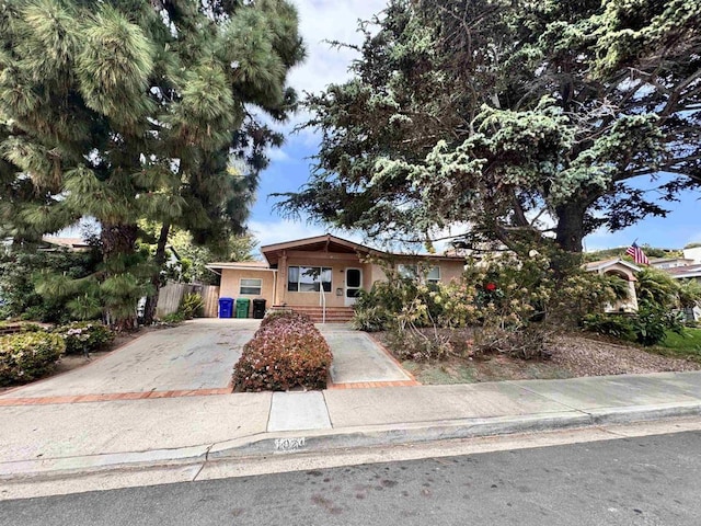 1020 Archer St, San Diego, CA 92109 - view of front of property with concrete driveway and a porch