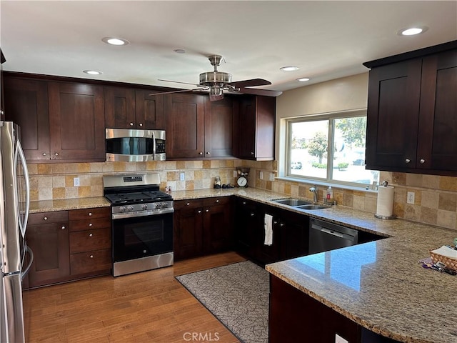 600 Morro Bay Blvd Unit 302, Morro Bay, CA 93442 - kitchen featuring light stone counters, a sink, appliances with stainless steel finishes, and ceiling fan