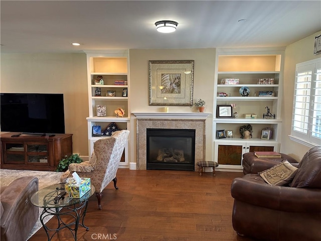 600 Morro Bay Blvd Unit 302, Morro Bay, CA 93442 - living area with built in features, wood finished floors, and a fireplace
