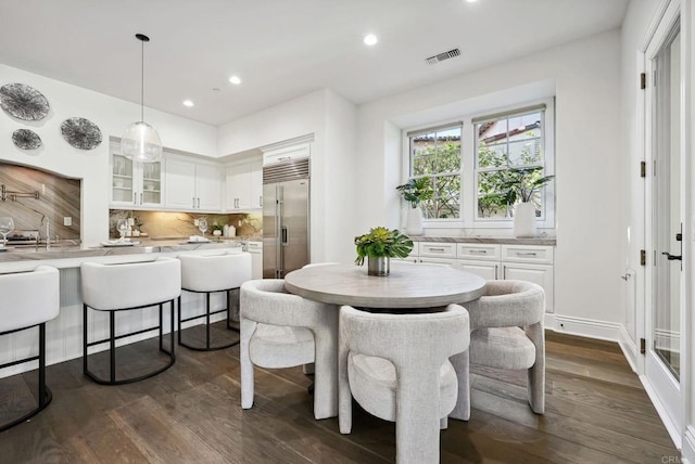 dining room with recessed lighting, visible vents, and dark wood finished floors