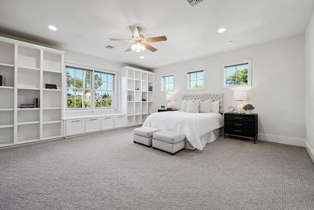 bedroom featuring visible vents, baseboards, recessed lighting, light colored carpet, and a ceiling fan