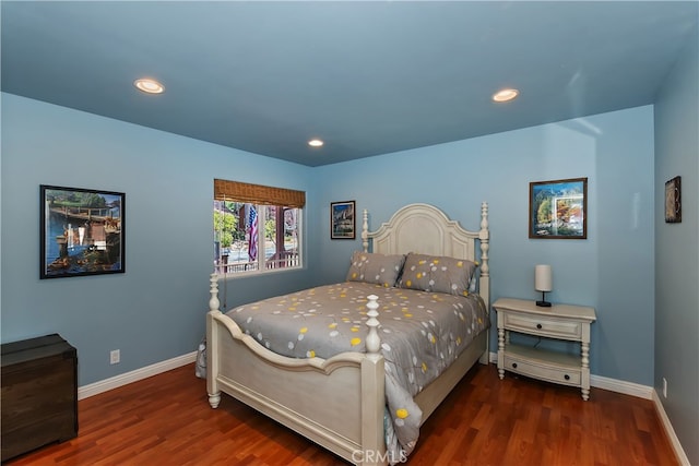 bedroom with recessed lighting, baseboards, and wood finished floors